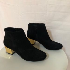 Black booties with gold heel